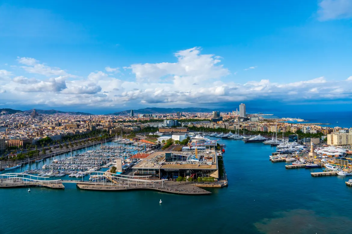 Aerial view of Marina Port Vell in Barcelona showing the Maremagnum complex and Rambla de Mar swing bridge with superyachts moored at Spain's central superyacht marina