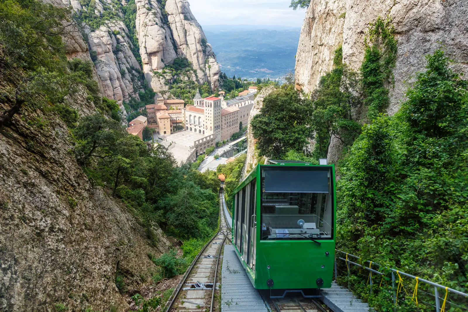 Breathtaking views from the Sant Joan funicular at Montserrat, stretching across miles of rolling Catalan hills, terraced valleys, and an endless sky that makes your heart pause