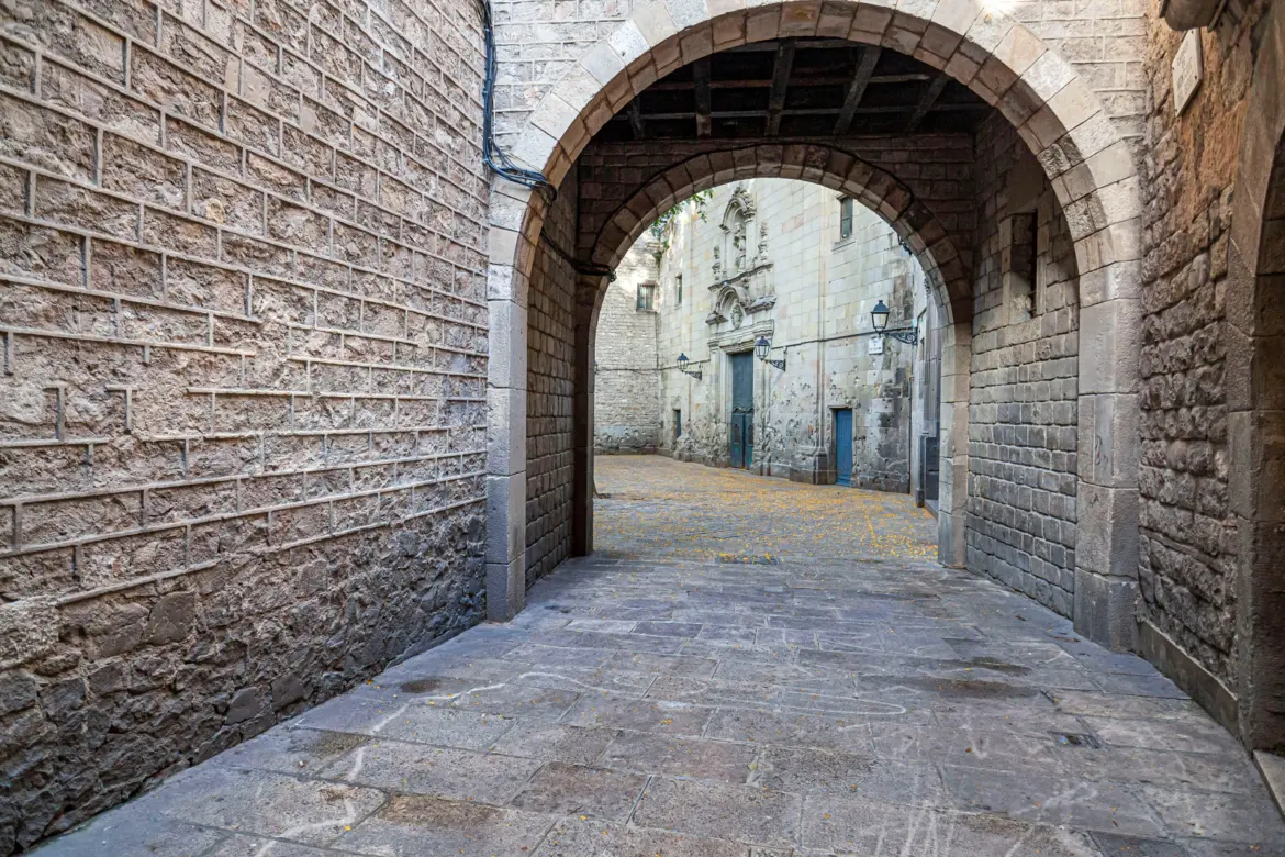 Plaça de Sant Felip Neri, a hidden square in Barcelona's Gothic Quarter where the baroque Church of Sant Felip Neri still bears the shrapnel scars of the January 30, 1938 Civil War bombing