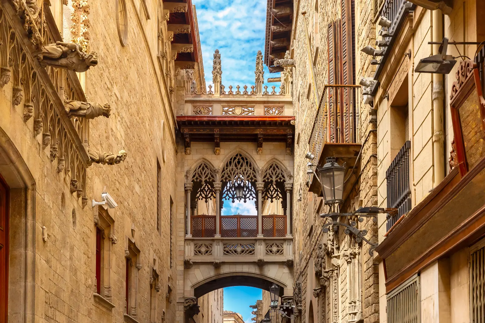The Pont del Bisbe (Bishop's Bridge) in Barcelona's Gothic Quarter, a neo-Gothic marble footbridge designed by Joan Rubió i Bellver in 1928 to connect the Palau de la Generalitat with the Casa dels Canonges across Carrer del Bisbe