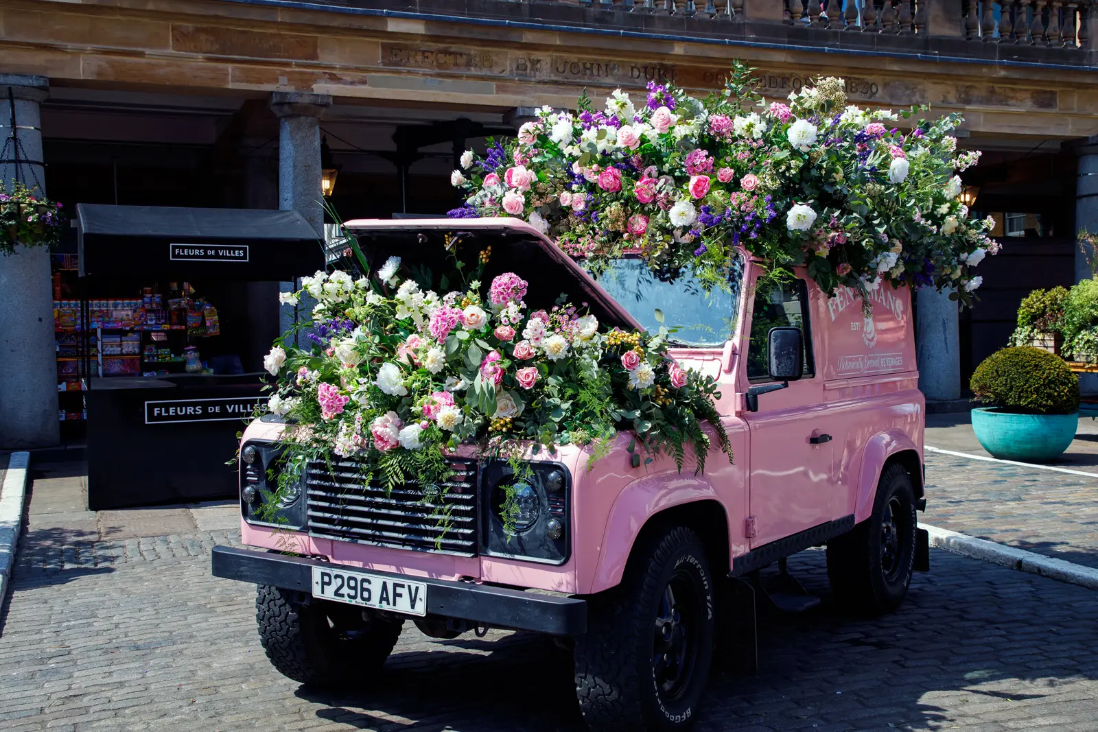 Elaborate floral installation decorating Covent Garden in London, reflecting the neighbourhood's theatrical atmosphere and creative seasonal displays