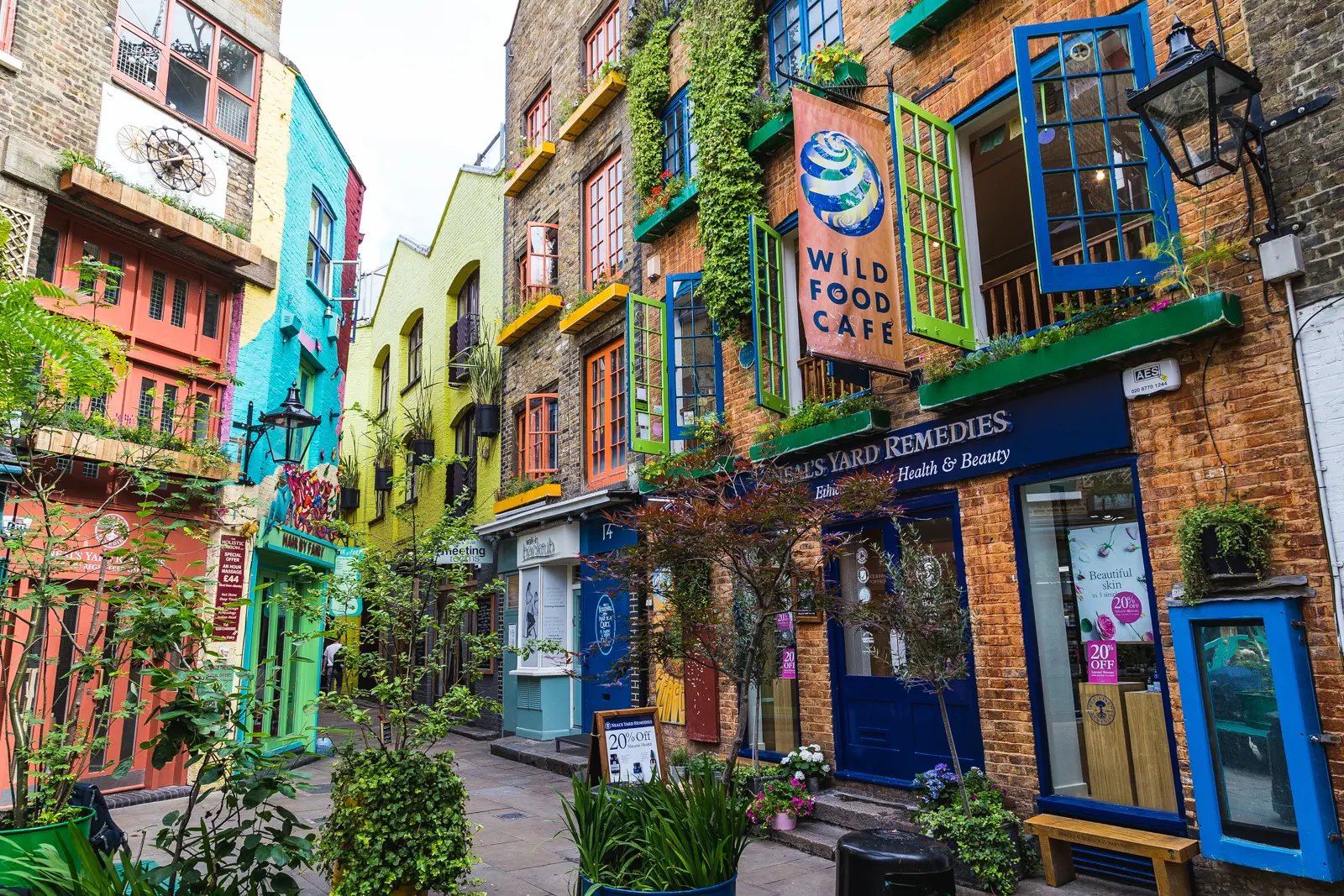 Colourful façades and independent shops in Neal's Yard near Covent Garden in London, one of the city's most charming hidden courtyards and creative neighbourhood spaces