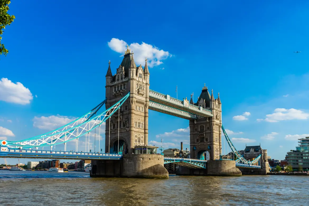 Iconic view of Tower Bridge rising above the River Thames in London. The Victorian bascule bridge has become one of London's most recognizable landmarks and enduring symbols of the city