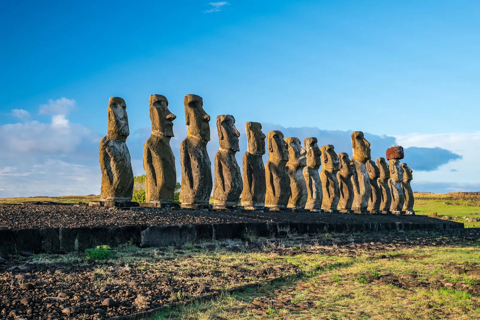Moai on the ahu platform at Ahu Tongariki, Easter Island (Rapa Nui), fifteen figures standing in a row facing inland