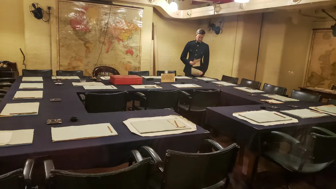 The Cabinet Room in the Churchill War Rooms, London, with its world map and a standing figure of an officer