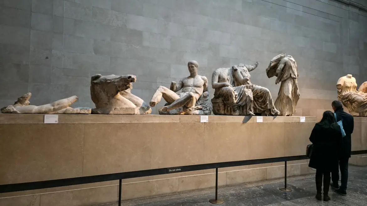 Gods from the Parthenon's east pediment at the British Museum, London, reclining and seated in marble along the gallery wall