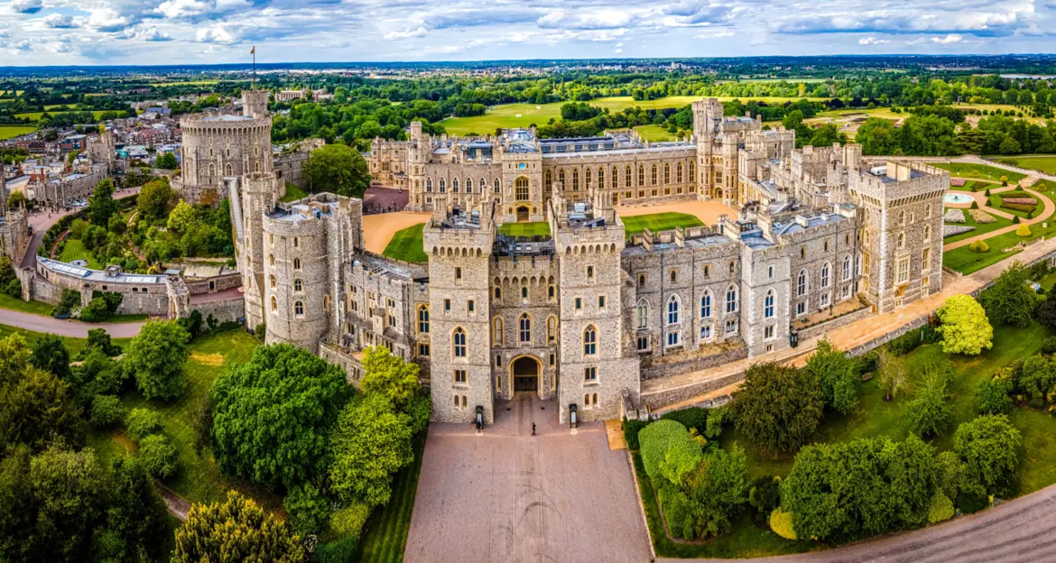 Aerial view of Windsor Castle showing the Round Tower, the State Apartments and the Long Walk running into the countryside
