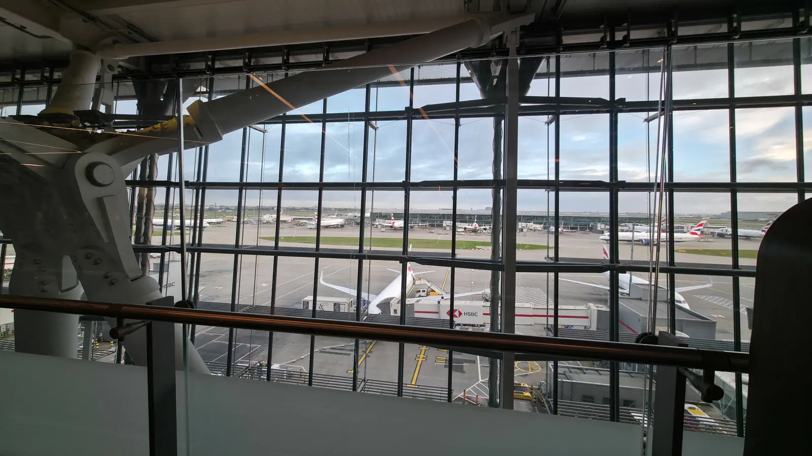 The view of British Airways aircraft parked at the gates through the windows at Heathrow Terminal 5
