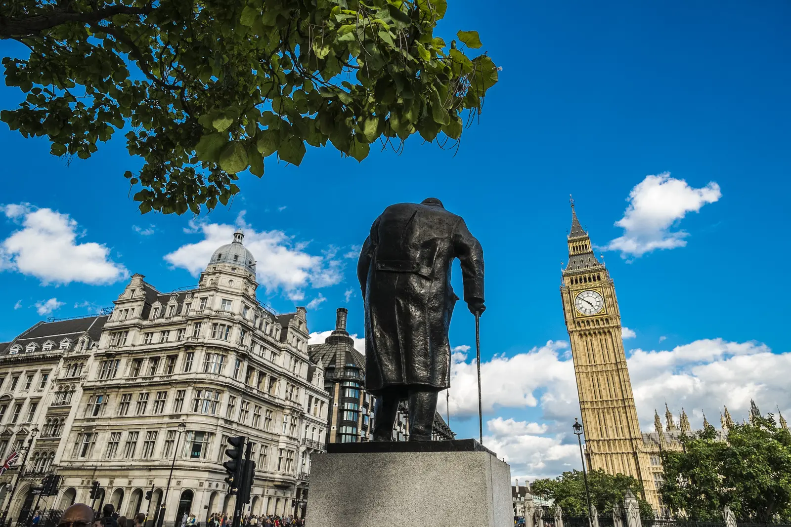 The bronze statue of Winston Churchill in Parliament Square, with Big Ben rising behind it, London