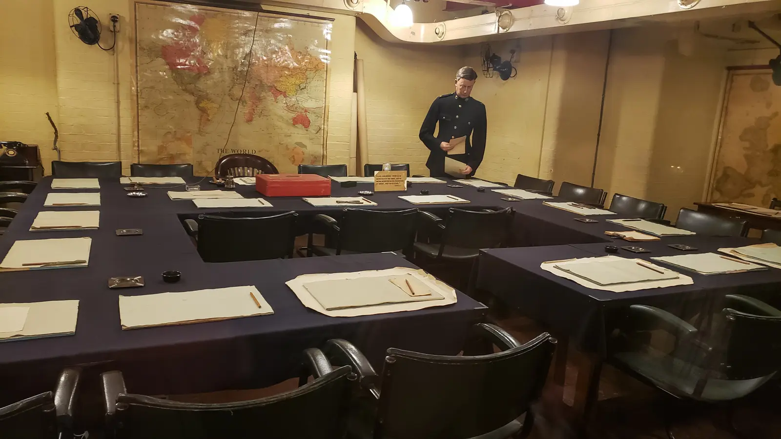 The Cabinet Room in the Churchill War Rooms, with its ring of tables, wall map and a mannequin, London
