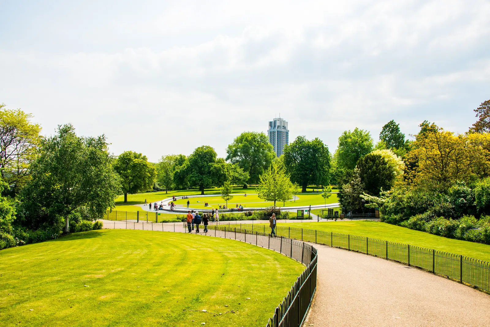 The Memorial Fountain seen across Hyde Park, with the tower of the Knightsbridge barracks rising behind the trees, London.