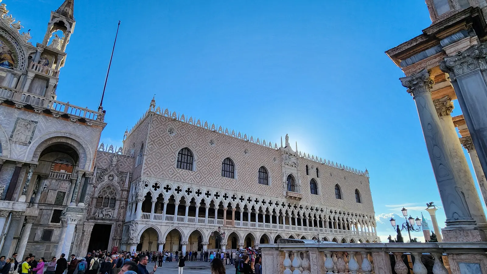 The Venetian Gothic facade of the Doge's Palace in pink-and-white stone, from the Piazzetta, Venice