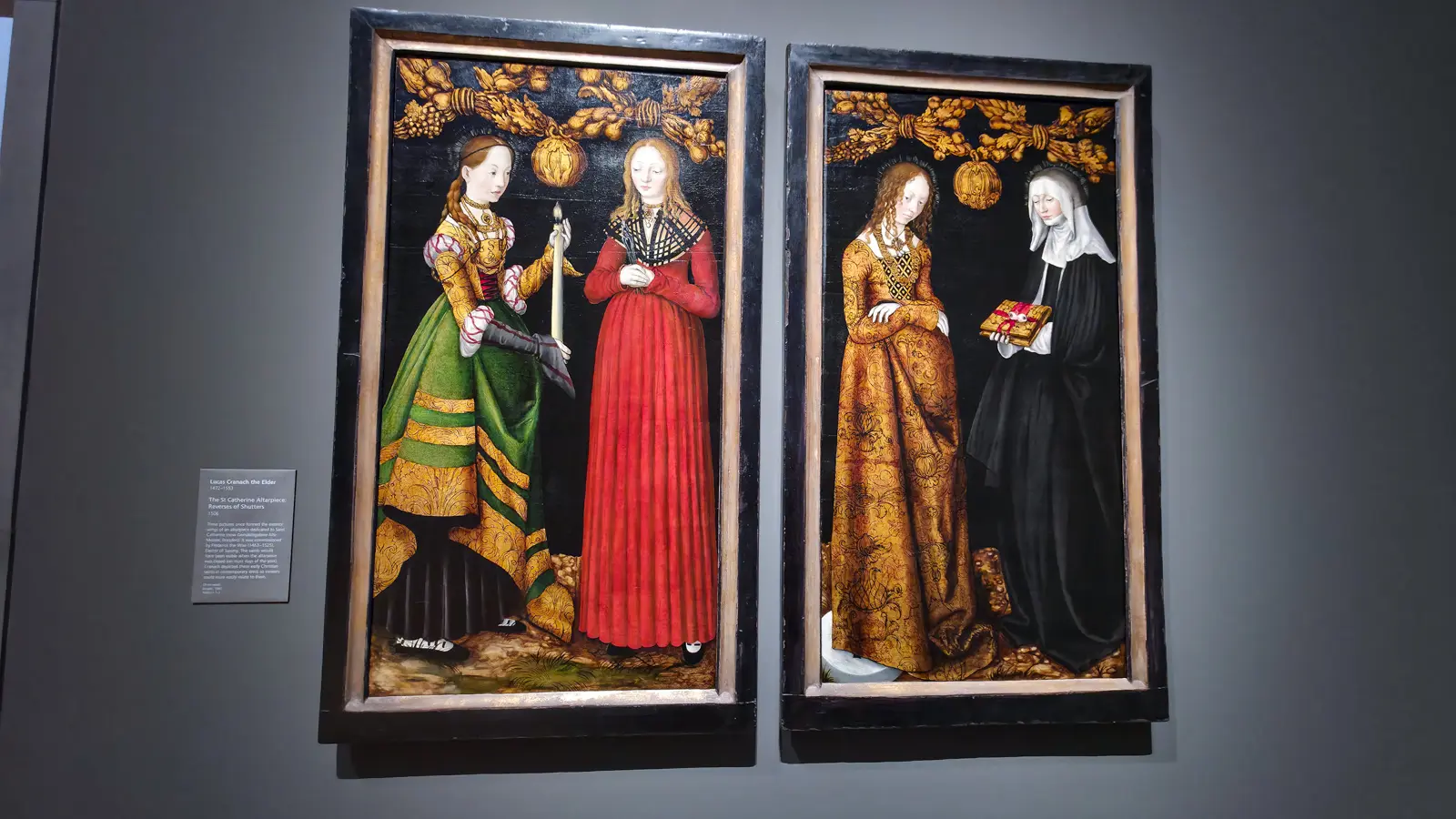 The St Catherine Altarpiece: Reverses of Shutters by Lucas Cranach the Elder, four female saints in German dress against dark grounds, National Gallery, London.