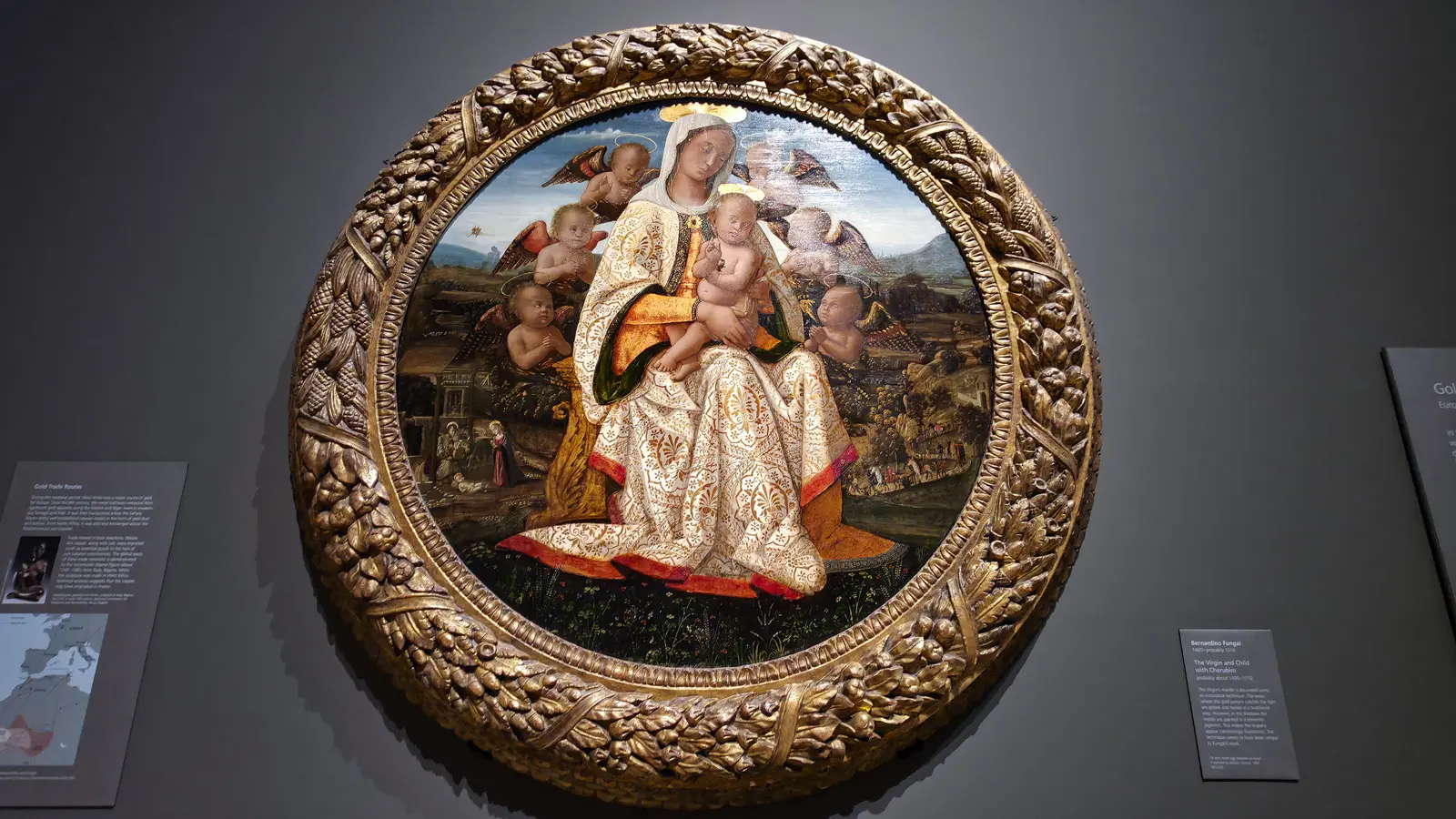 Bernardino Fungai's The Virgin and Child with Cherubim at the National Gallery, London, a circular panel of the Virgin in white and gold ringed by red-winged angels in a deeply carved gilt frame.