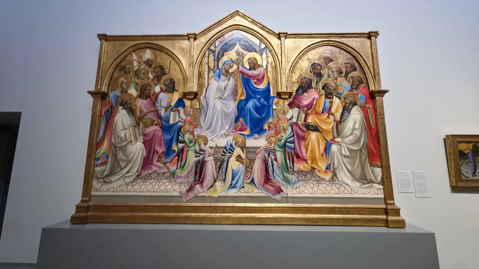 Lorenzo Monaco's The Coronation of the Virgin at the National Gallery, London, Christ crowning Mary on a throne among kneeling angels and ranks of saints under three gilded arches.