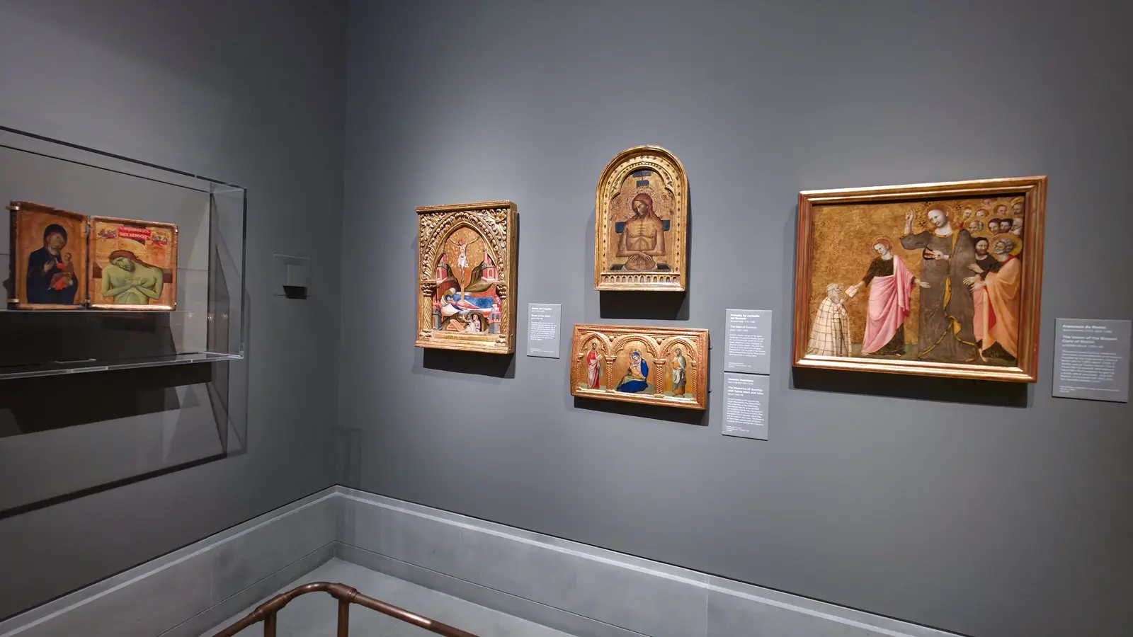 A corner of fourteenth-century gold-ground panels at the National Gallery, London, including an upright Man of Sorrows and a horizontal Madonna of Humility.