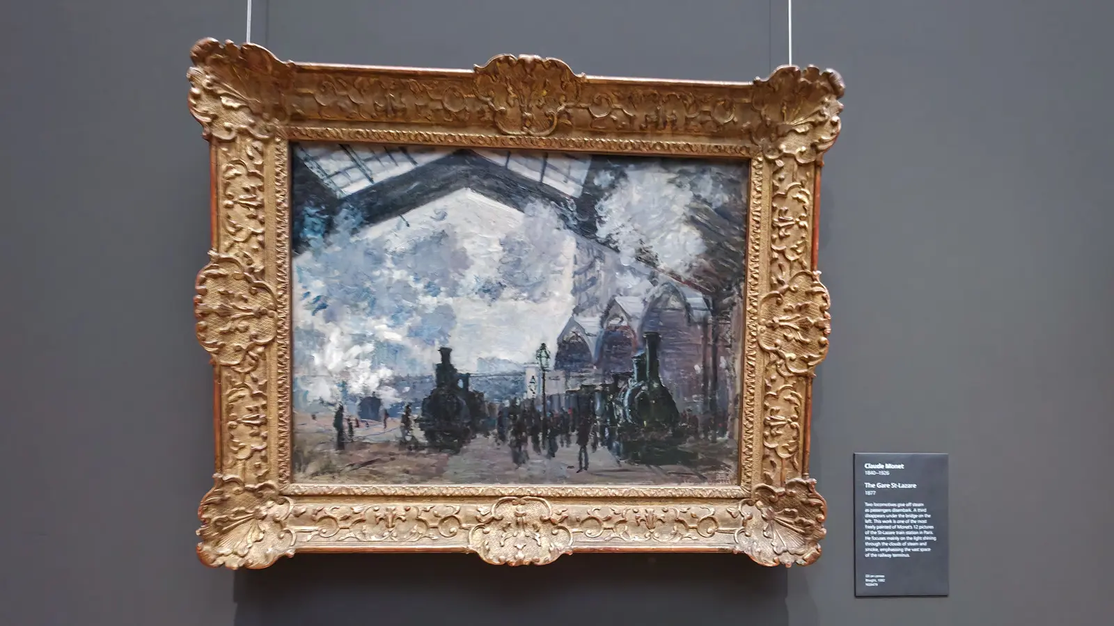 Monet's painting The Gare St-Lazare, steam and locomotives under a glass station roof, at the National Gallery, London