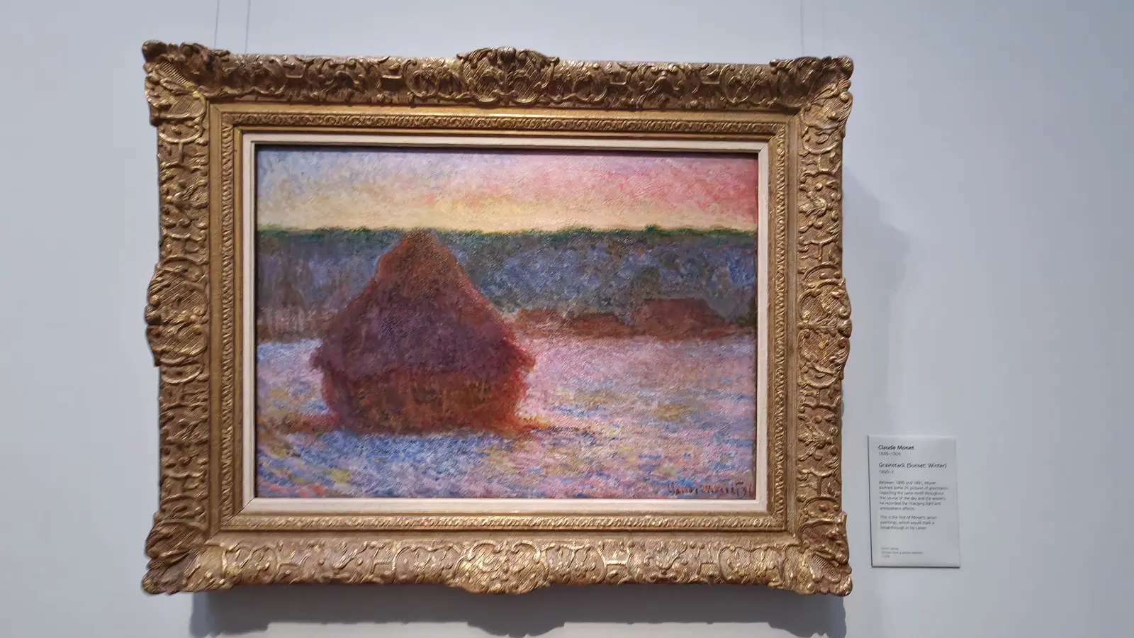 Monet's painting Grainstack (Sunset: winter), a haystack against a pink sky, at the National Gallery, London