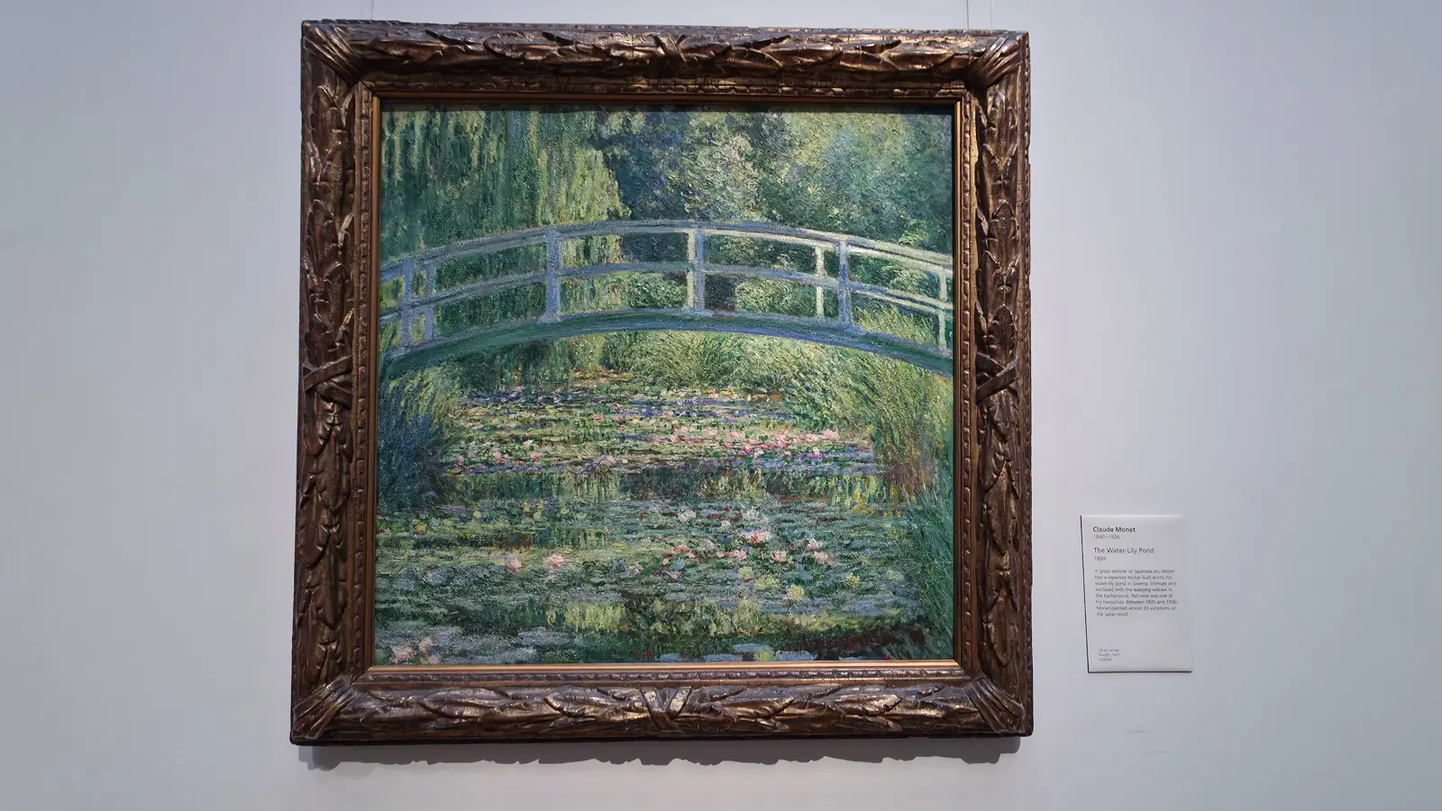 Monet's painting The Water-Lily Pond, the green Japanese bridge arching over the lily pond, at the National Gallery, London