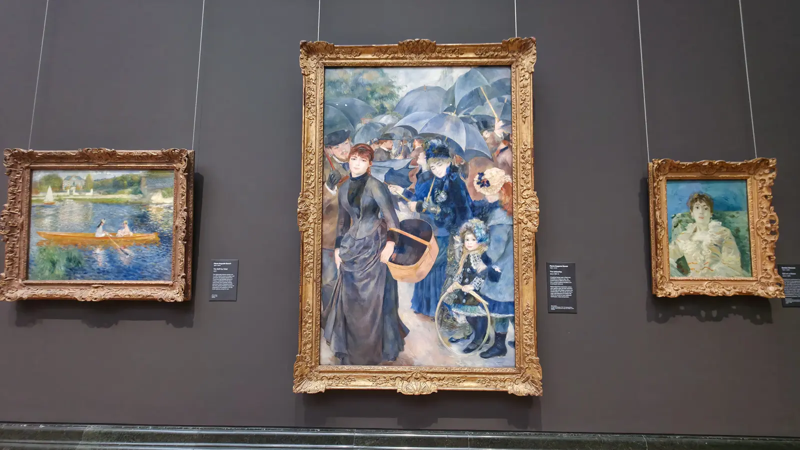 Renoir's The Umbrellas, centre, hung between The Skiff and a Berthe Morisot, National Gallery, London