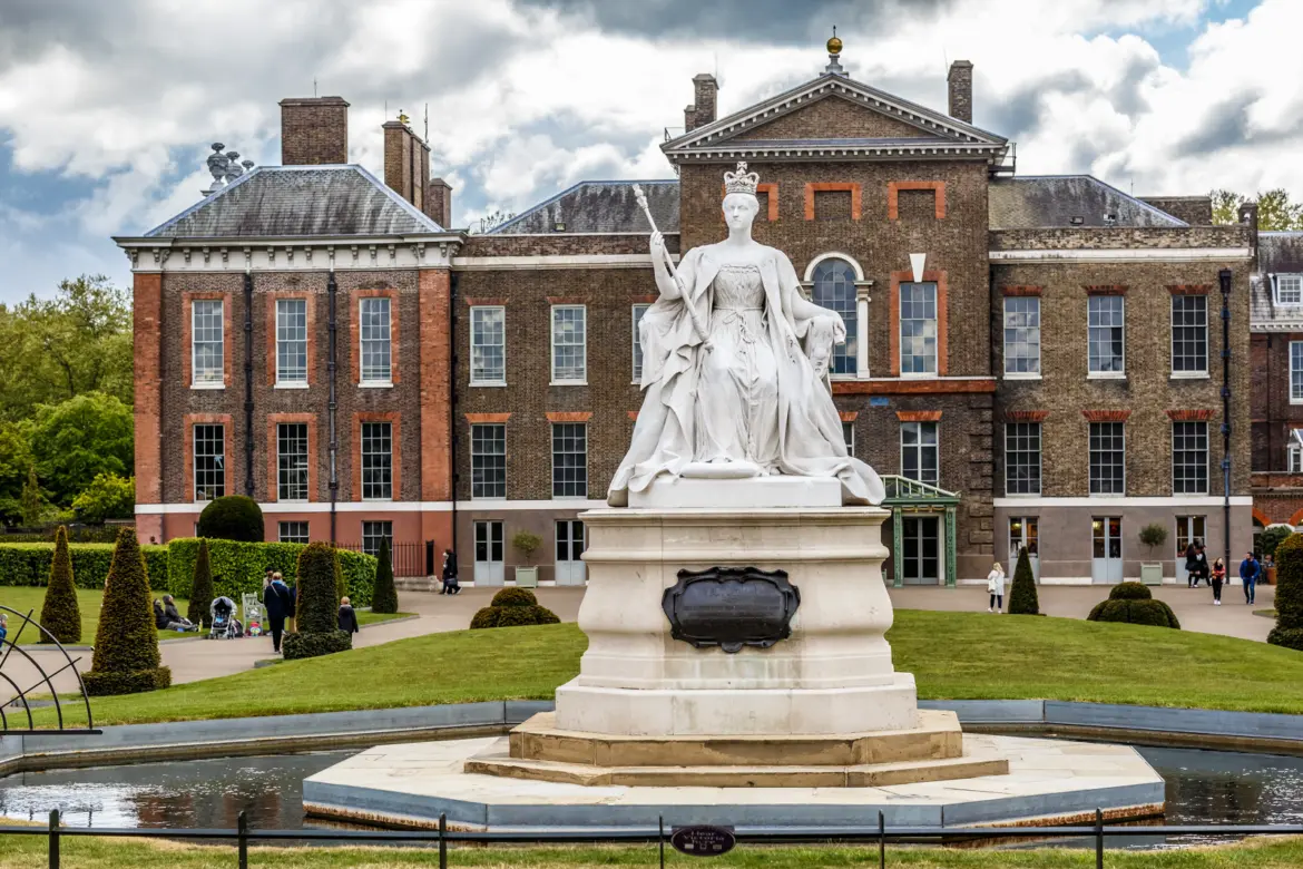 Marble statue of the young Queen Victoria on the Broad Walk in front of Kensington Palace, London