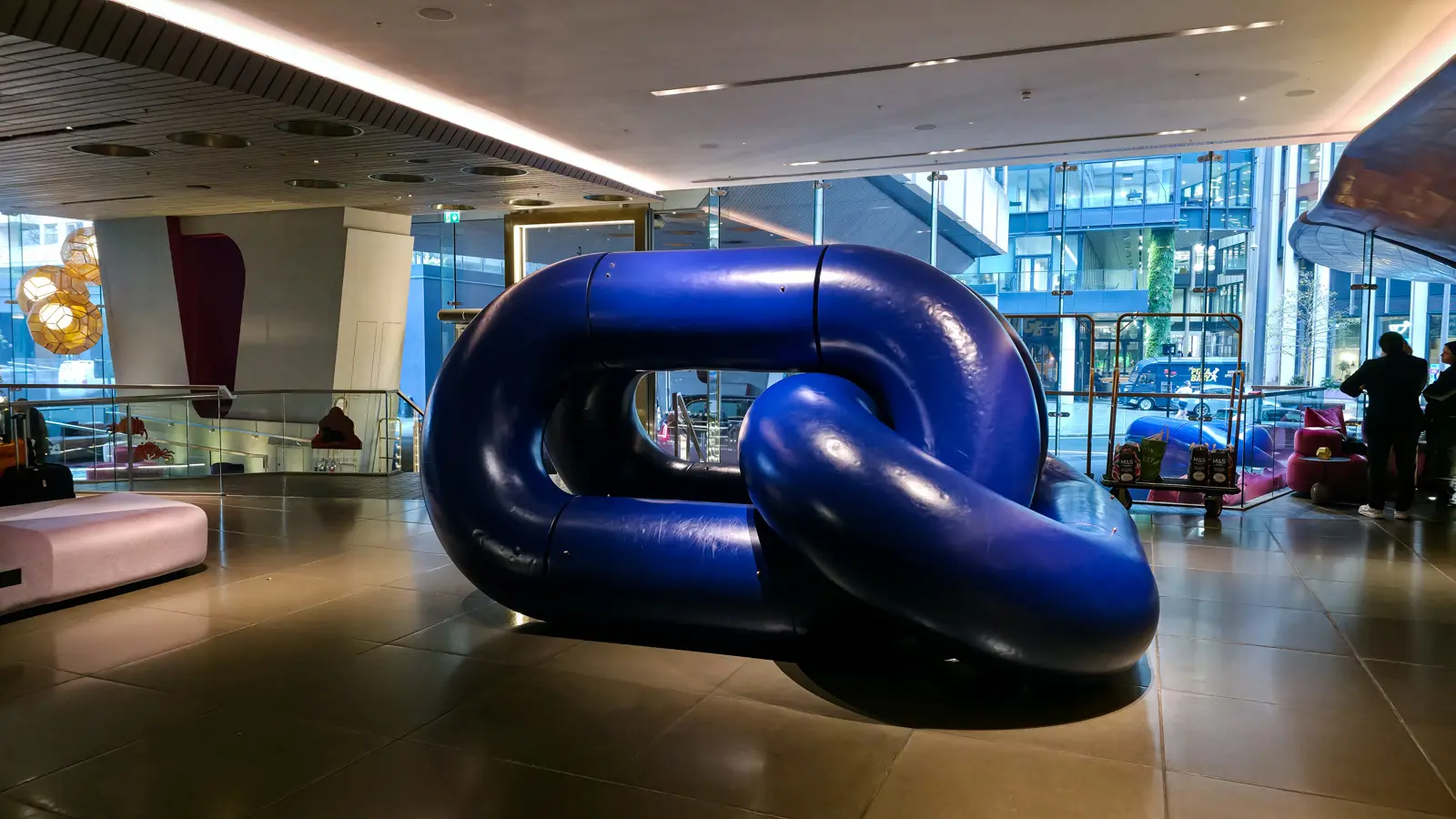 A large blue and purple knotted sculpture in the lobby of Sea Containers London
