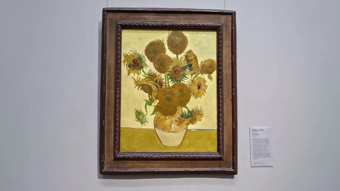 Van Gogh Sunflowers in its gilt frame at the National Gallery in London, yellow blooms against a yellow ground