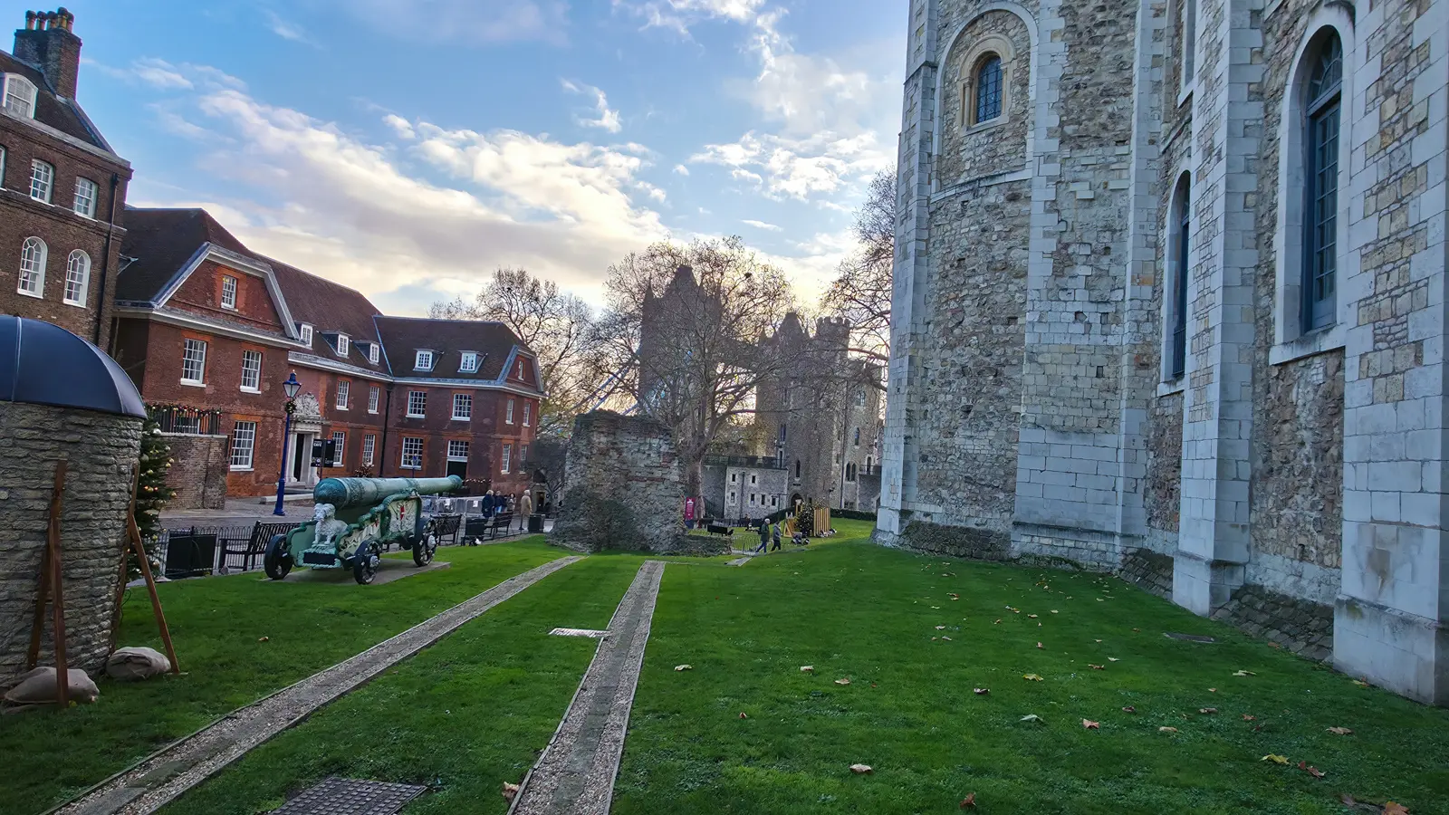 The ruined stub of the Wardrobe Tower standing on the lawn beside the White Tower at the Tower of London