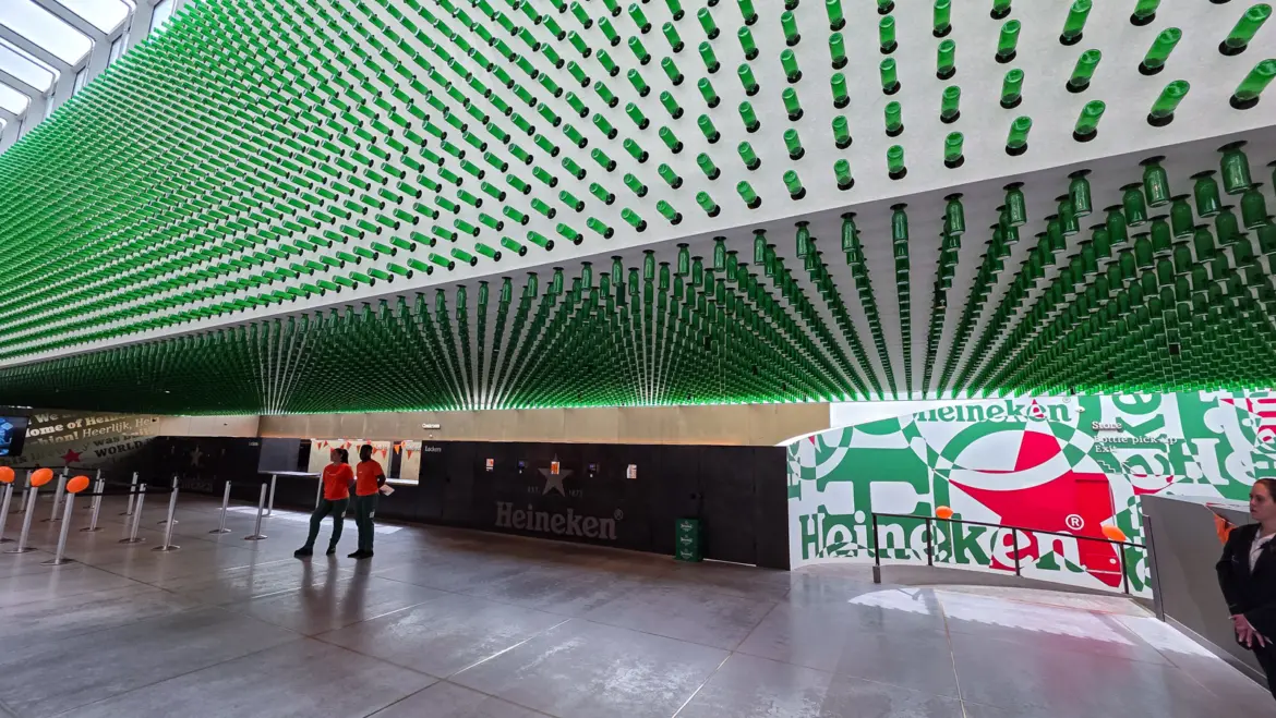 Thousands of green bottles suspended from the ceiling above the entrance hall of the Heineken Experience, Amsterdam