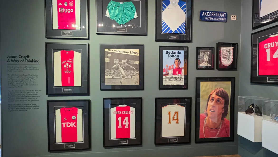 The Johan Cruyff: A Way of Thinking wall at the Moco Museum Amsterdam, hung with framed shirts, posters and a blue street sign