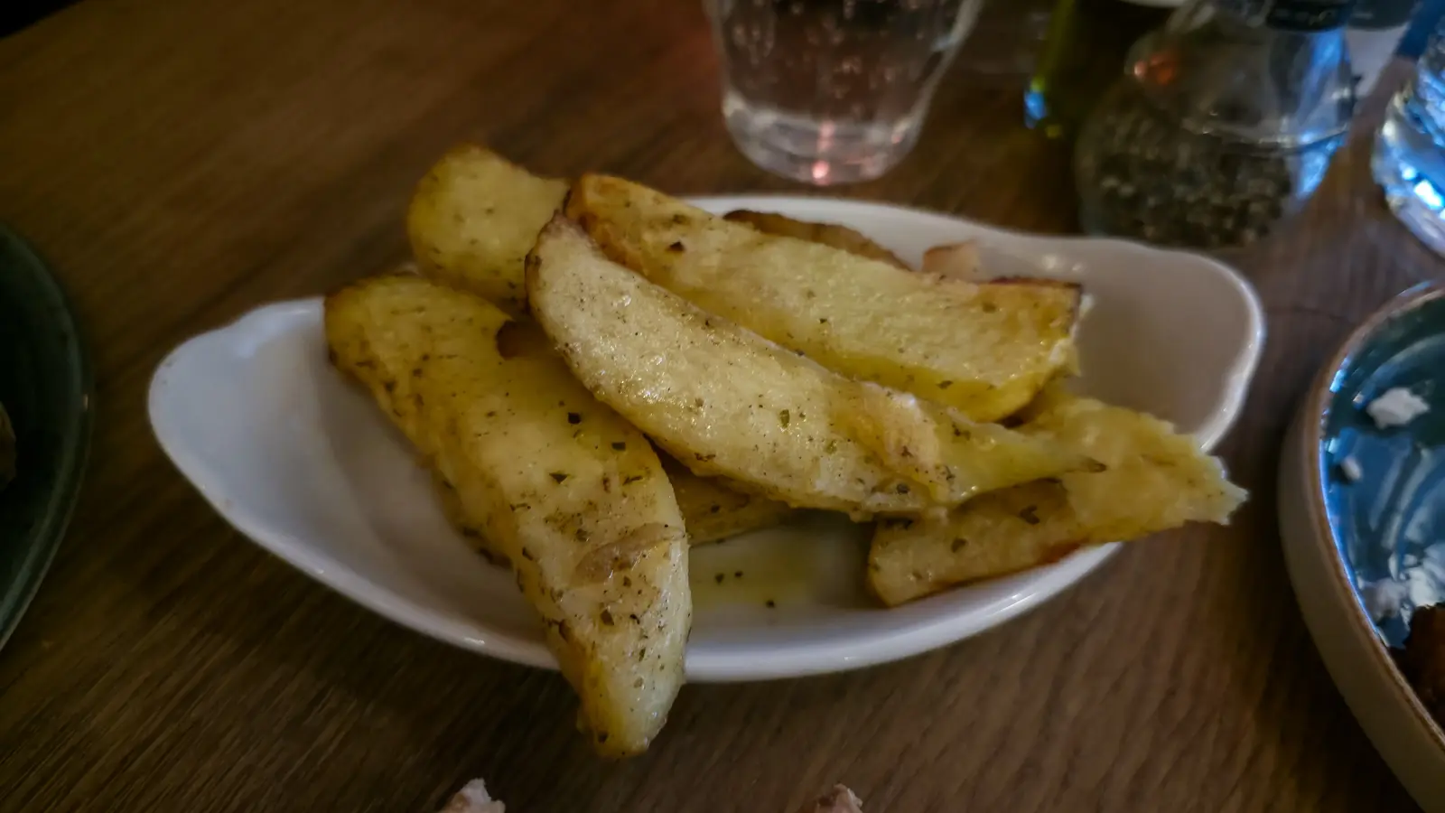 Oven-roasted lemon potatoes at Oresti’s Taverna, cut into thick wedges and glossy with olive oil