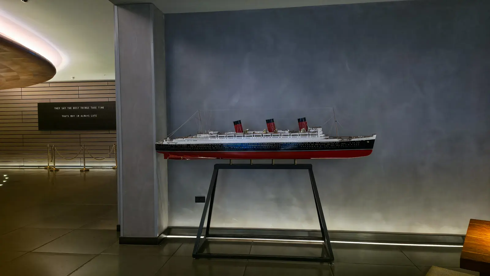A scale model of the RMS Queen Mary in the lobby of Sea Containers London, in Cunard livery with three red-and-black funnels