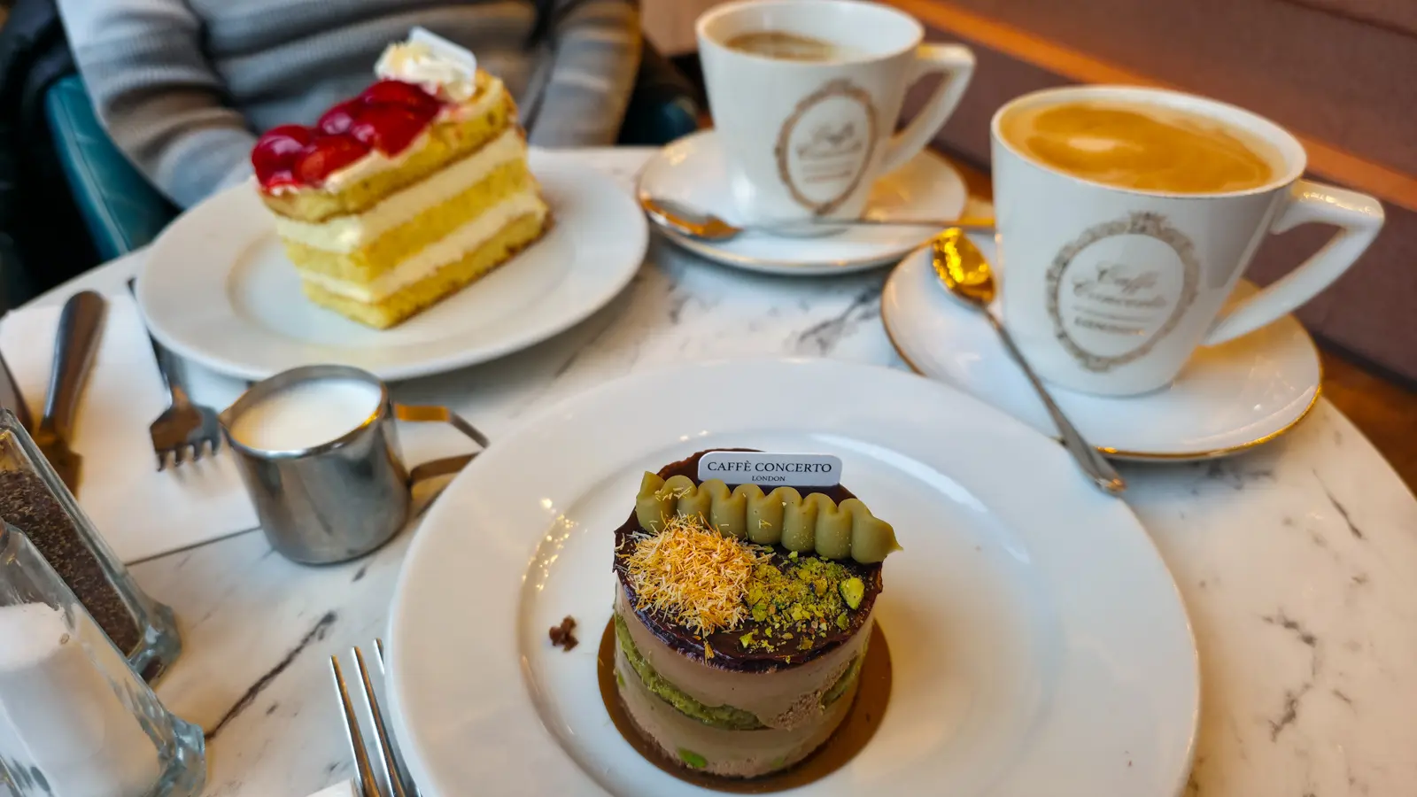Coffee and cake at The Grand by Concerto near Trafalgar Square: a strawberry gateau and the café’s Dubai chocolate cake