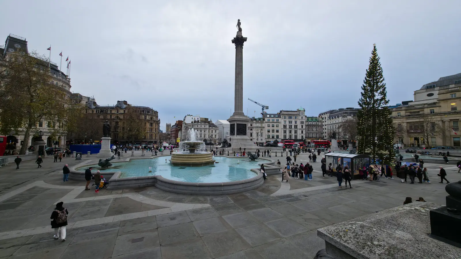Trafalgar Square seen from the National Gallery steps, with Nelson’s Column, the fountains and the Christmas tree, in central London