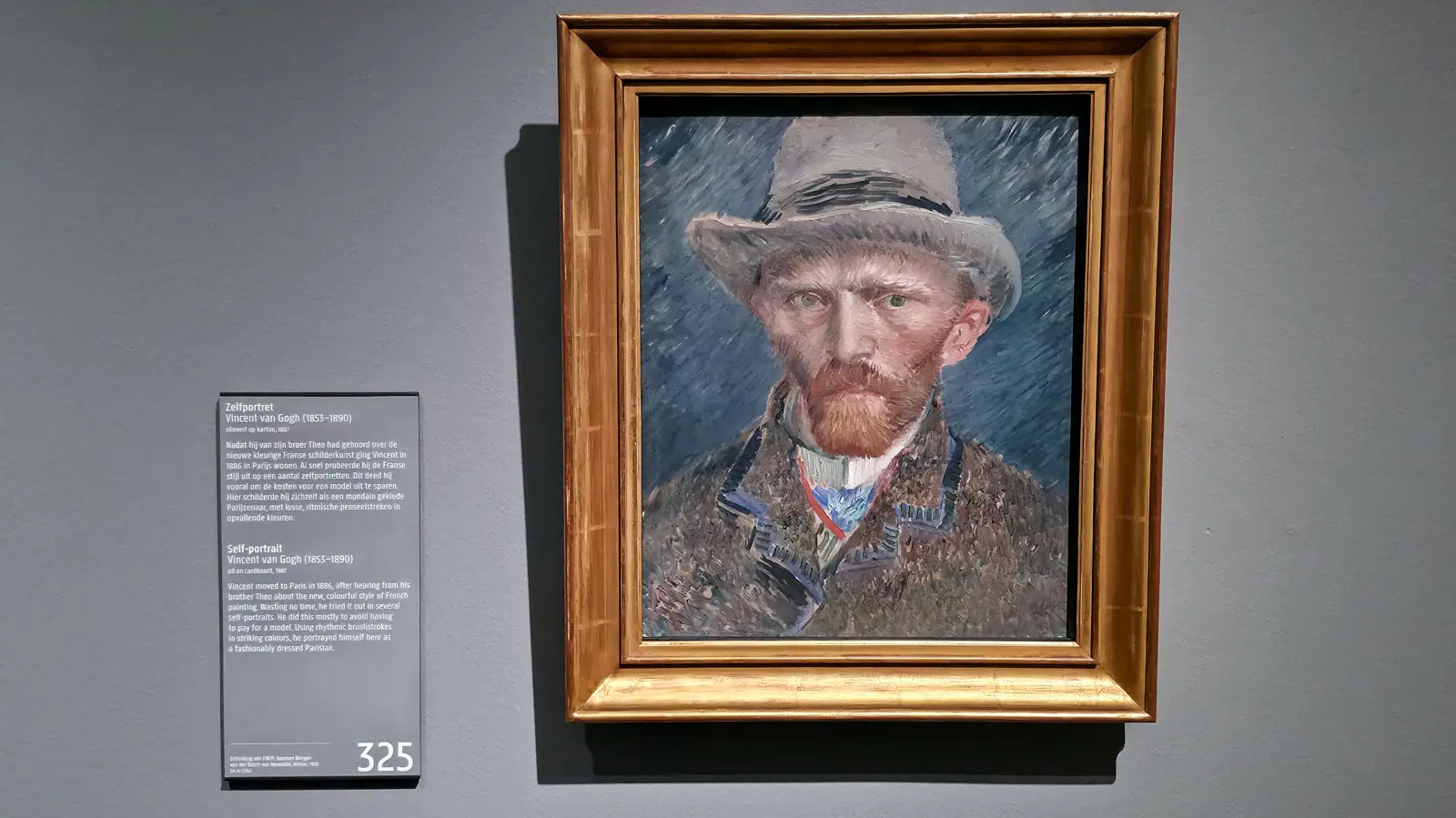 Van Gogh’s self portrait in a grey felt hat at the Rijksmuseum, painted in short rhythmic strokes against a blue-grey ground