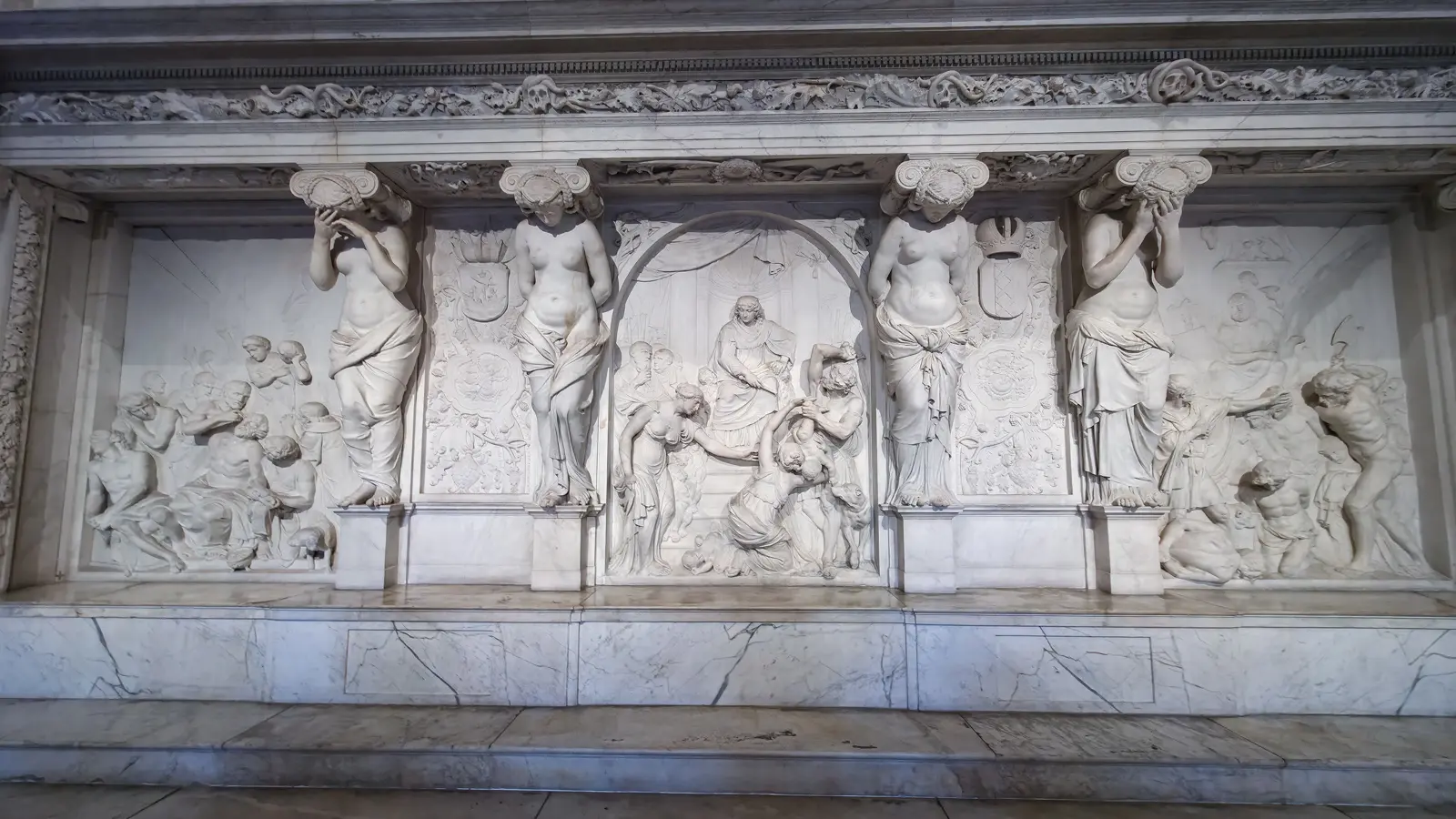 Marble relief wall of the Vierschaar, Royal Palace Amsterdam, with four caryatids flanking the central Judgement of Solomon