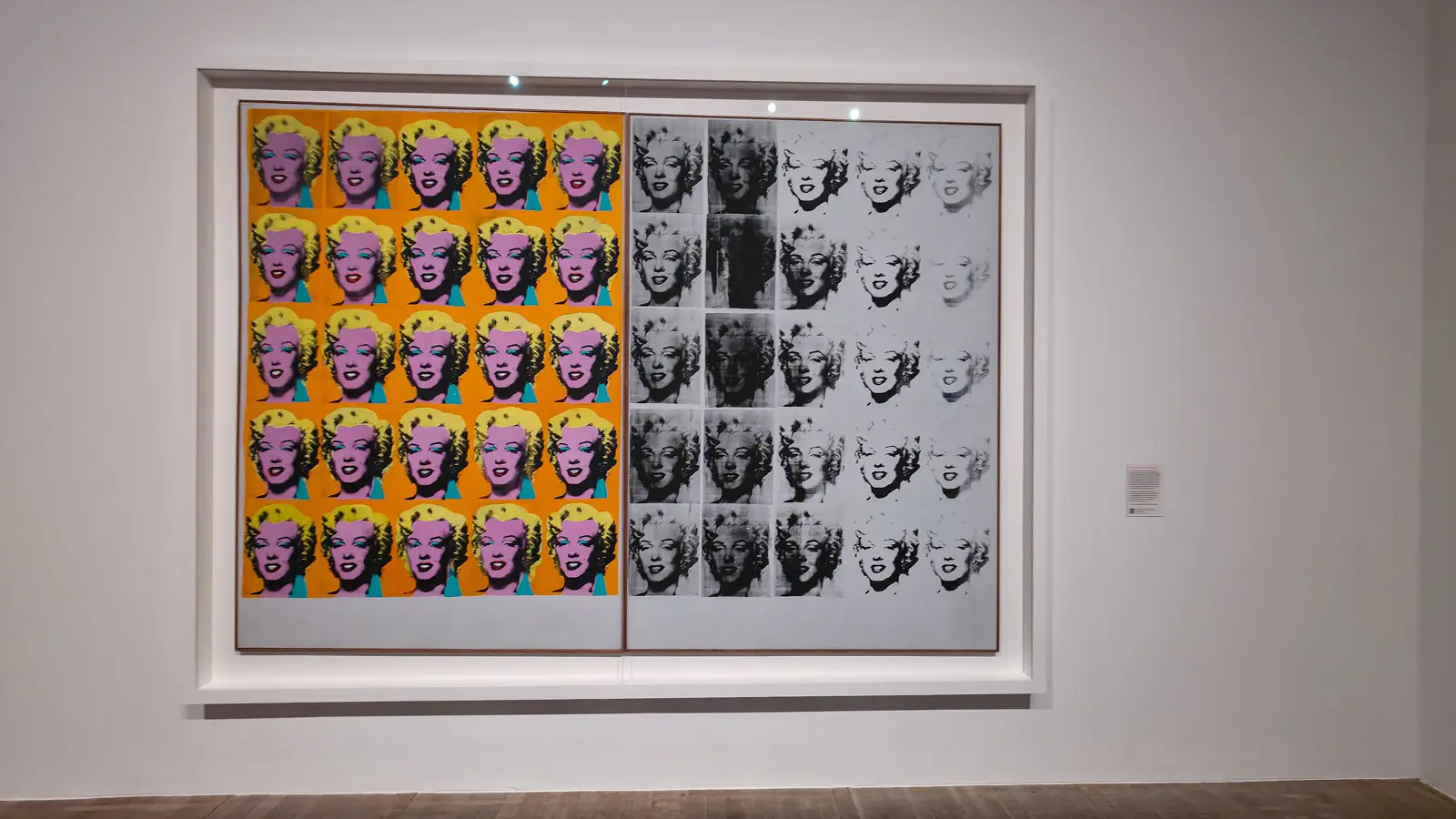 Andy Warhol’s Marilyn Diptych (1962) at Tate Modern, London, fifty Marilyn Monroe faces, colour at left fading to black and white at right