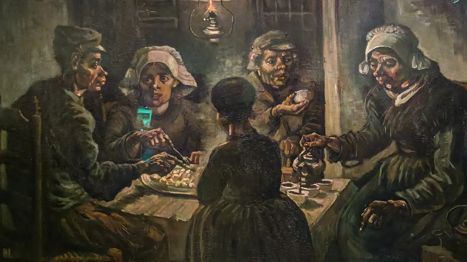 The Potato Eaters in detail, showing the hands and faces of the family at the table