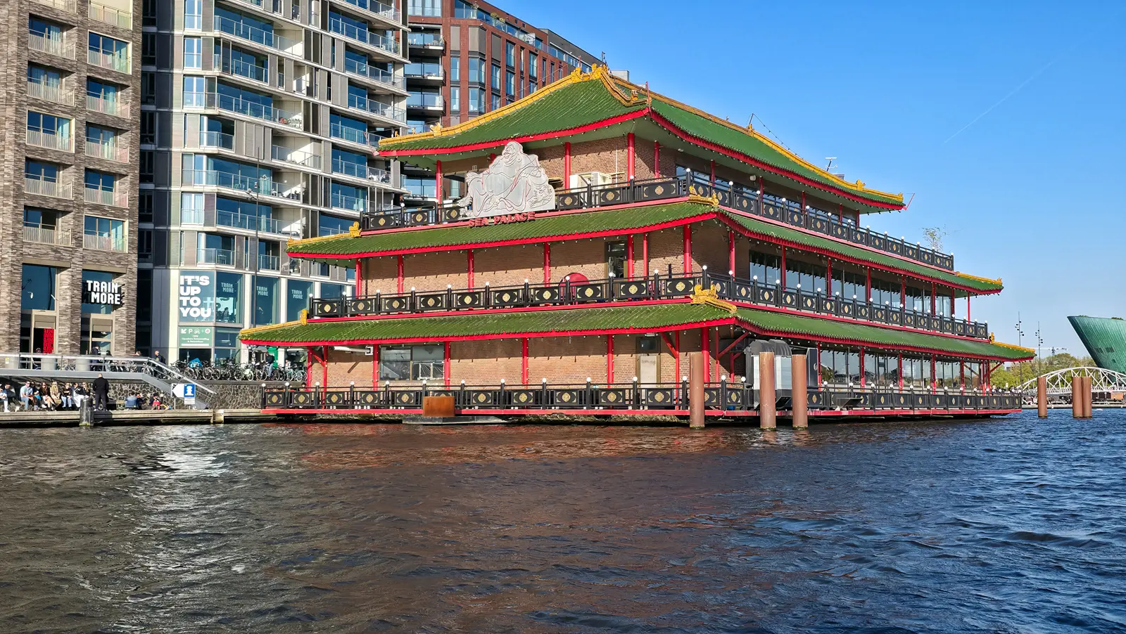 Sea Palace, the floating Chinese restaurant in Amsterdam, three pagoda storeys with green tiled roofs, red columns and gold detailing