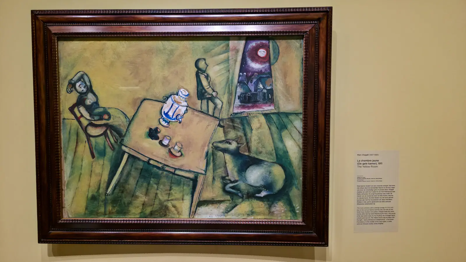 Marc Chagall's The Yellow Room (1911), a cow, a white samovar and two figures in a tilted room glowing yellow and green, at the Van Gogh Museum