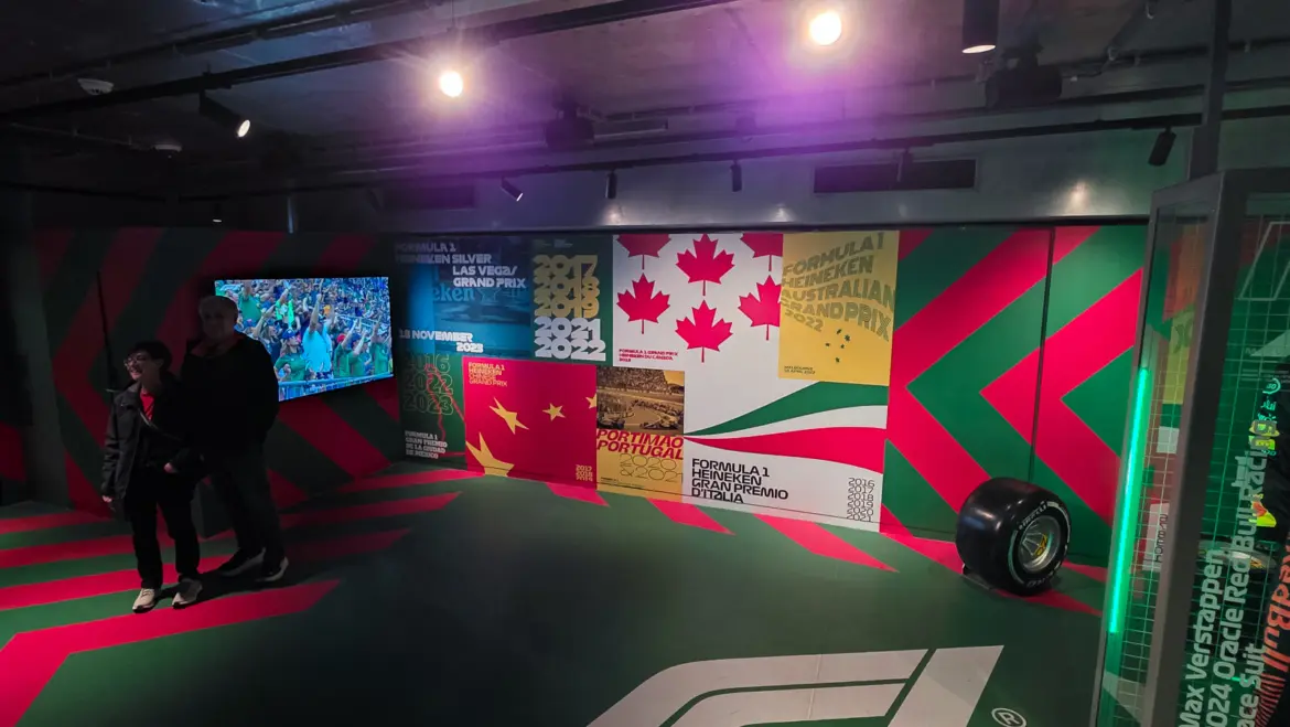Formula 1 room at the Heineken Experience with a wall of Grand Prix posters and a Pirelli tyre, Amsterdam