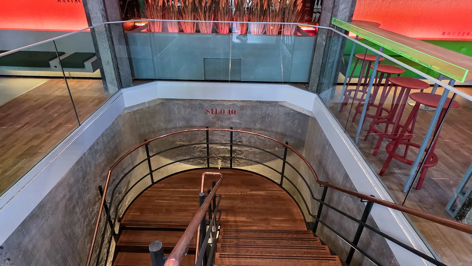 Stairwell curving down through a former grain silo stencilled SILO 10 in red, Heineken Experience, Amsterdam