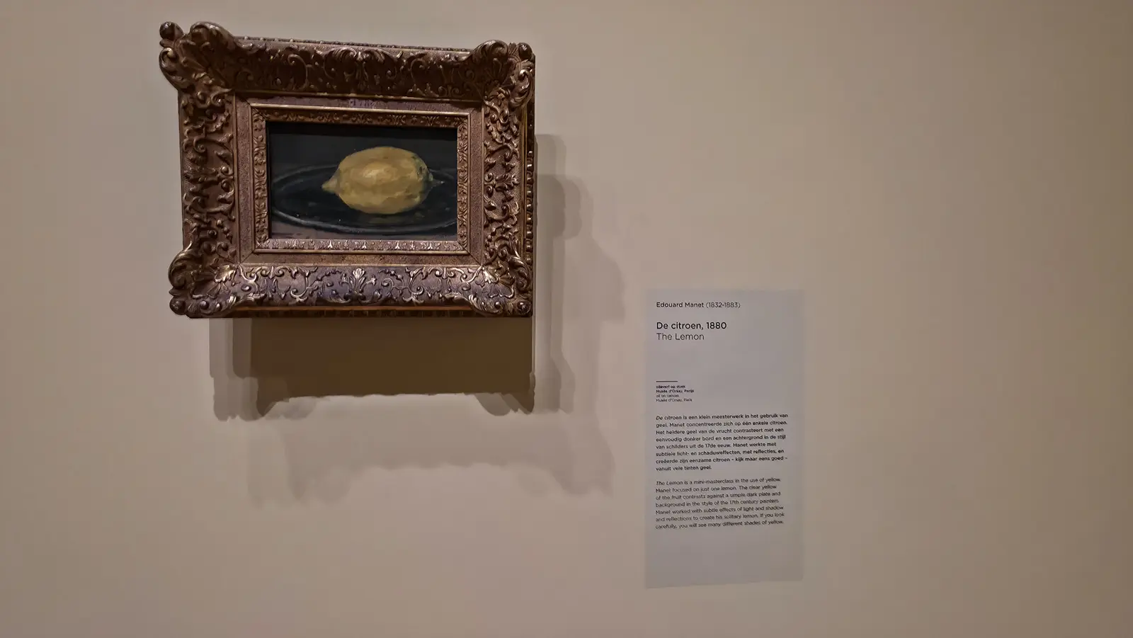 Edouard Manet's The Lemon (1880), a single lemon on a dark plate in a heavy ornate gilt frame, at the Van Gogh Museum