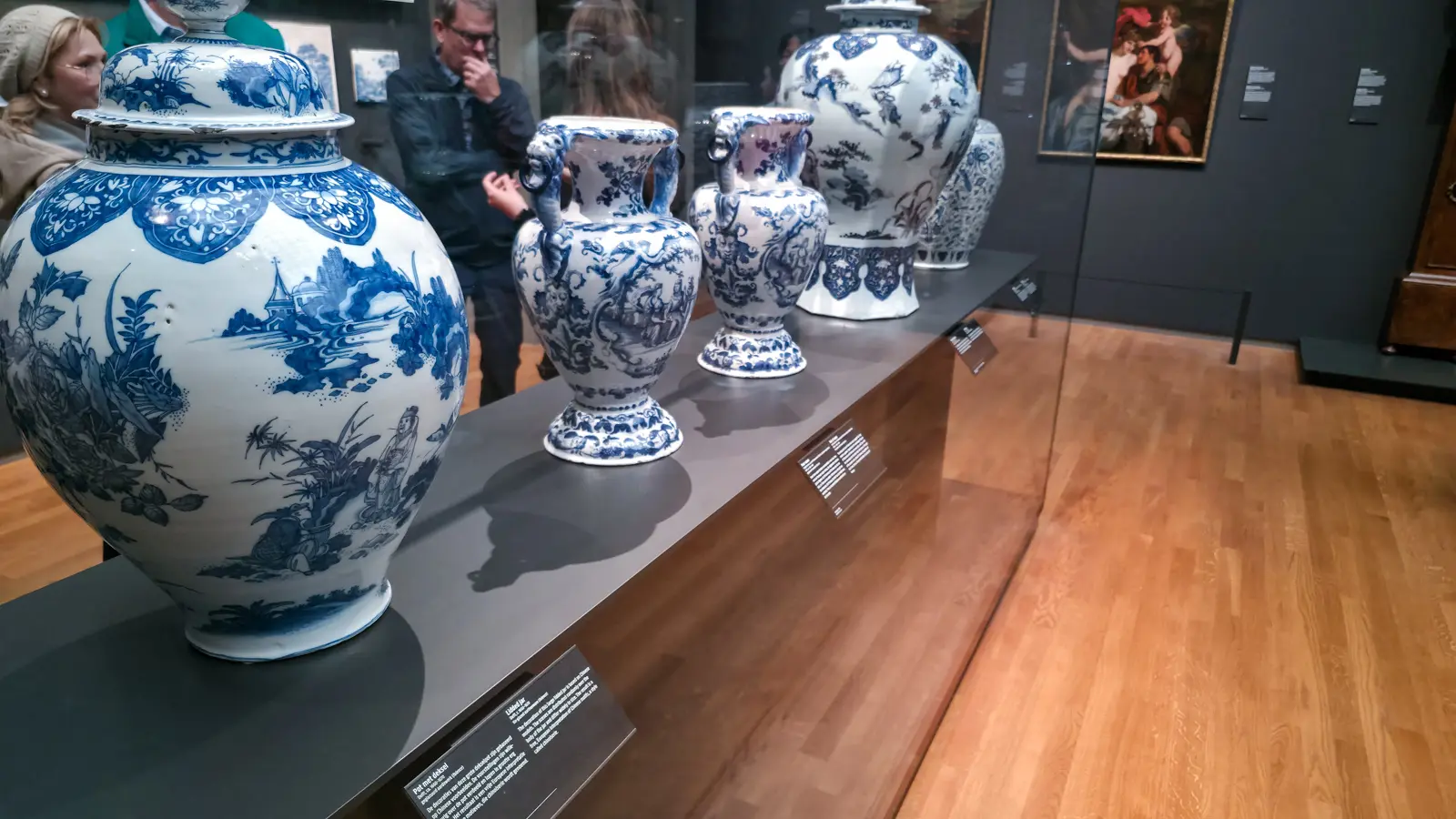 Large Delft lidded jar and pairs of blue and white vases on a museum plinth, Rijksmuseum, Amsterdam