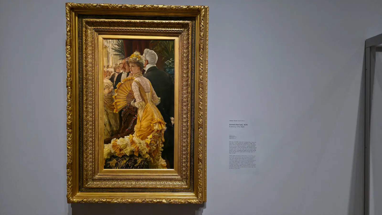 James Tissot's Evening (The Ball) (1878), a young woman in a ruffled golden yellow gown with a fan beside an older man in evening dress, at the Van Gogh Museum