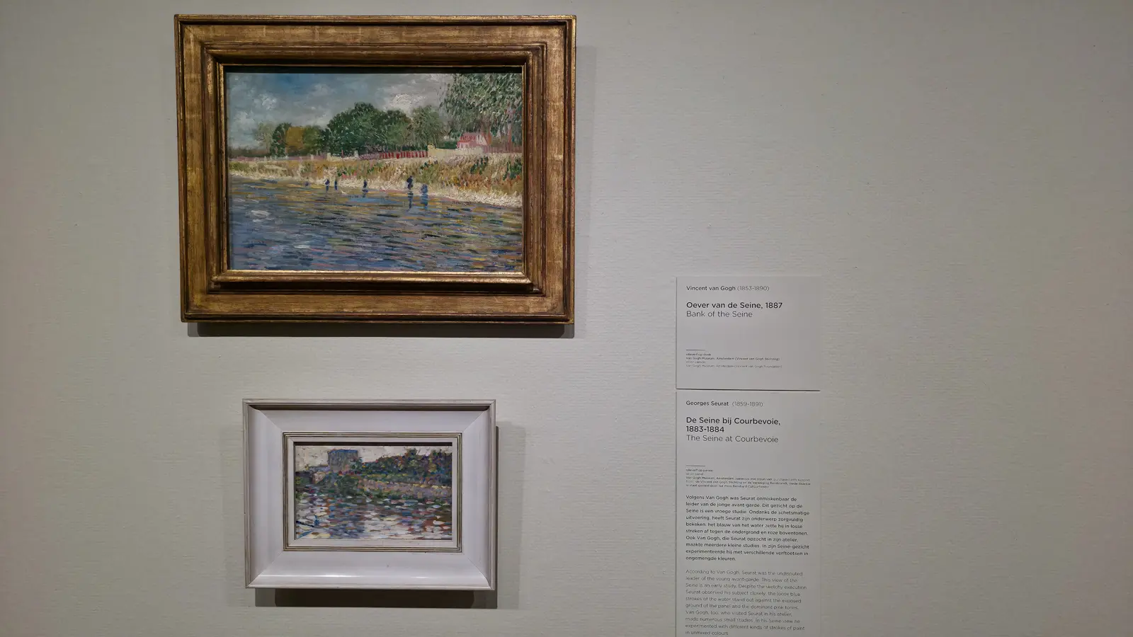 Van Gogh's Bank of the Seine (1887) hung above Georges Seurat's smaller The Seine at Courbevoie at the Van Gogh Museum, Amsterdam