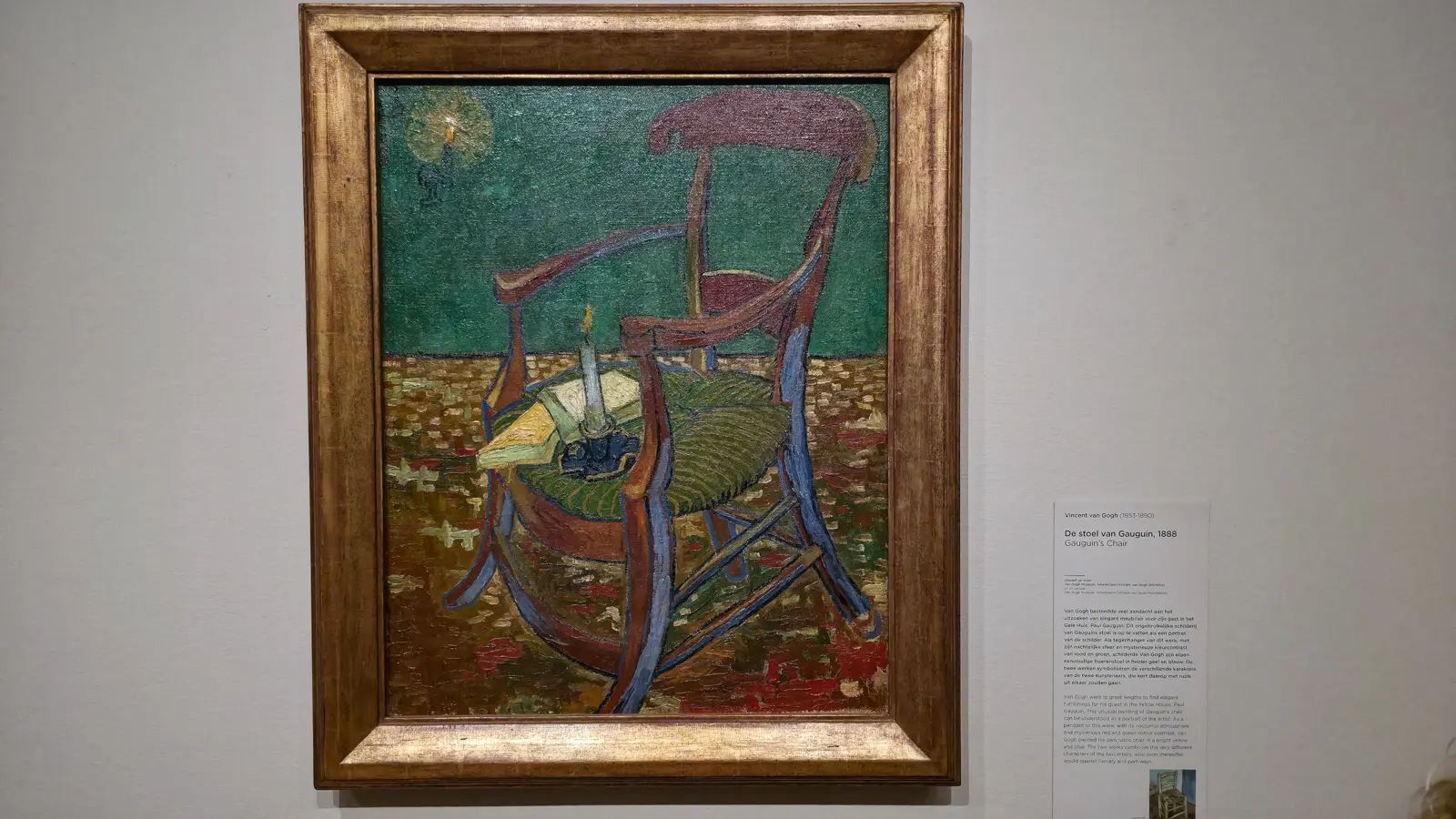 Gauguin’s Chair, 1888, by Vincent van Gogh, an empty armchair with a candle and books, at the Van Gogh Museum, Amsterdam