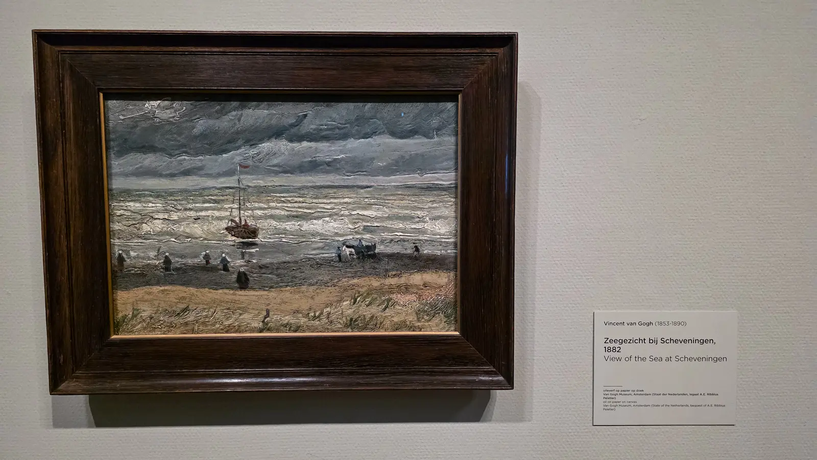 View of the Sea at Scheveningen, 1882, a fishing boat, a low grey stormy sea and small working figures on the sand, Van Gogh Museum, Amsterdam