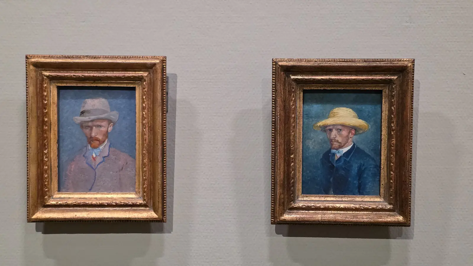 Two small 1887 Van Gogh panels hung as a pair, one in a grey felt hat, one in a straw hat, Van Gogh Museum, Amsterdam