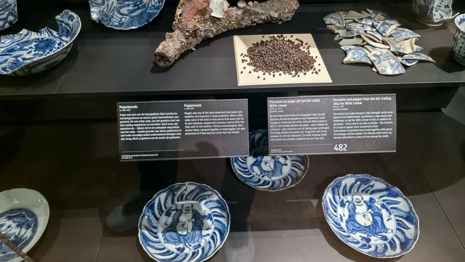 Peppercorns and encrusted iron from the wreck of the Witte Leeuw, with porcelain shards, Rijksmuseum, Amsterdam